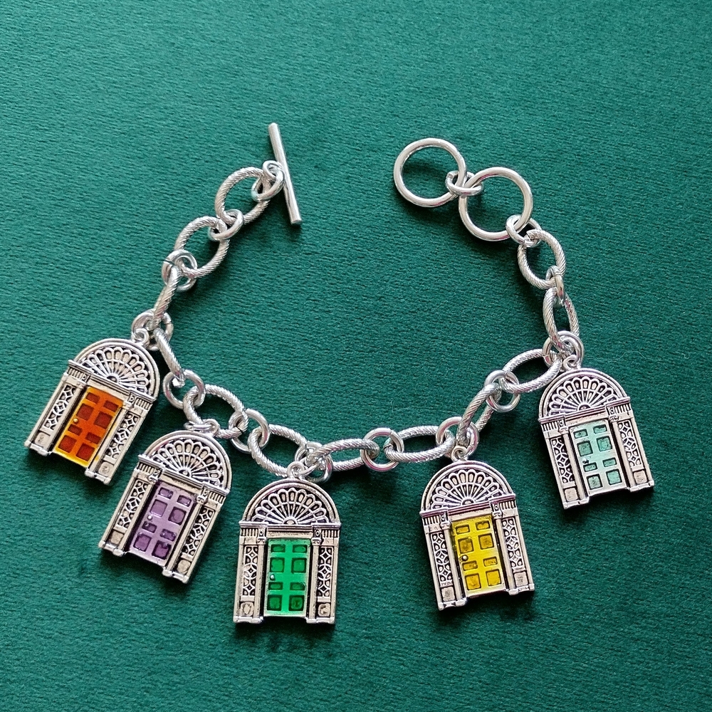 4/$20 Multicolor Doors of Ireland silver tone charm bracelet